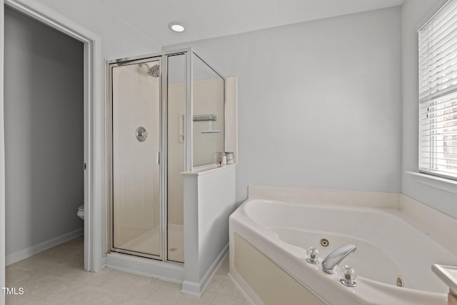 full bathroom with a tub with jets, toilet, a stall shower, and baseboards