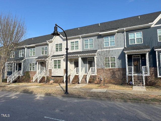 829 S Franklin St, Wake Forest, NC 27587 - townhome / multi-family property with board and batten siding and brick siding