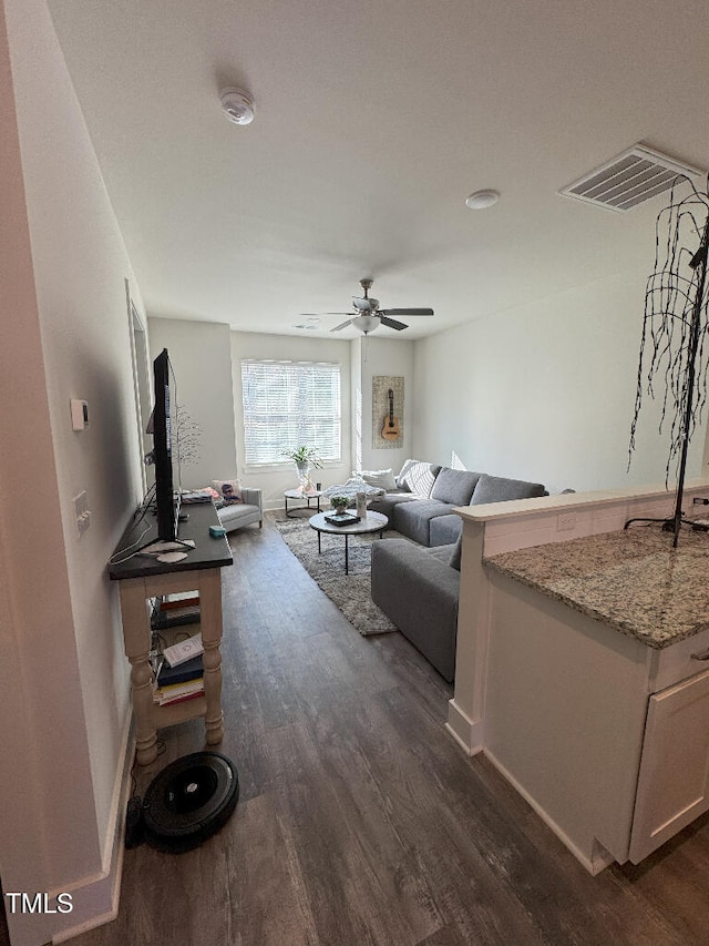 829 S Franklin St, Wake Forest, NC 27587 - living room with baseboards, ceiling fan, visible vents, and dark wood finished floors