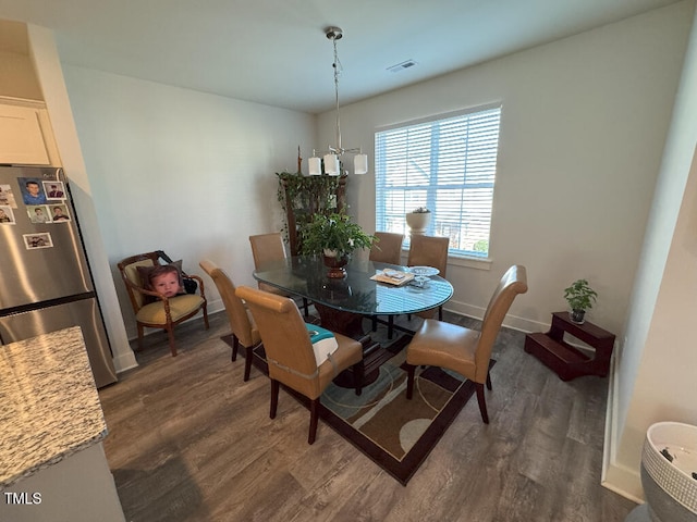 829 S Franklin St, Wake Forest, NC 27587 - dining area featuring dark wood-type flooring, baseboards, and visible vents