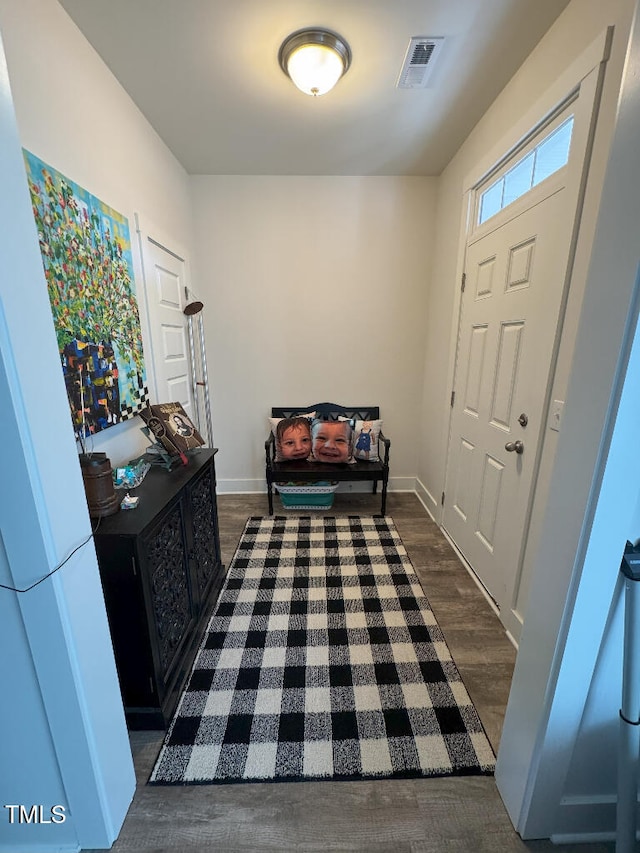 829 S Franklin St, Wake Forest, NC 27587 - entryway featuring dark wood-style floors, visible vents, and baseboards