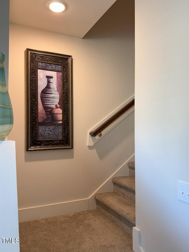 829 S Franklin St, Wake Forest, NC 27587 - staircase featuring baseboards and carpet flooring