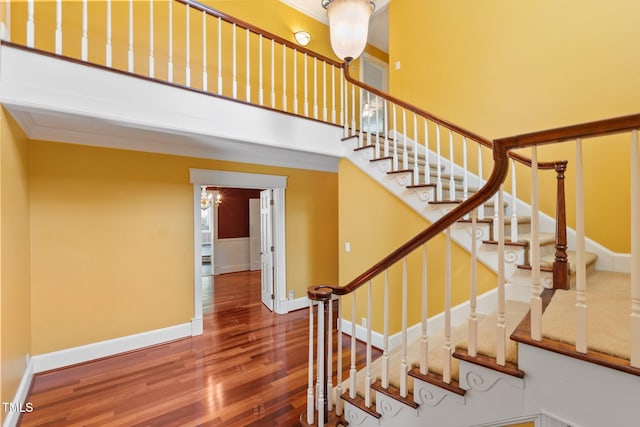 1302 Hermitage Rd, Sanford, NC 27330 - stairway with baseboards, wood finished floors, and crown molding