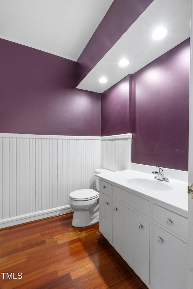1302 Hermitage Rd, Sanford, NC 27330 - bathroom with toilet, a wainscoted wall, vanity, and wood finished floors