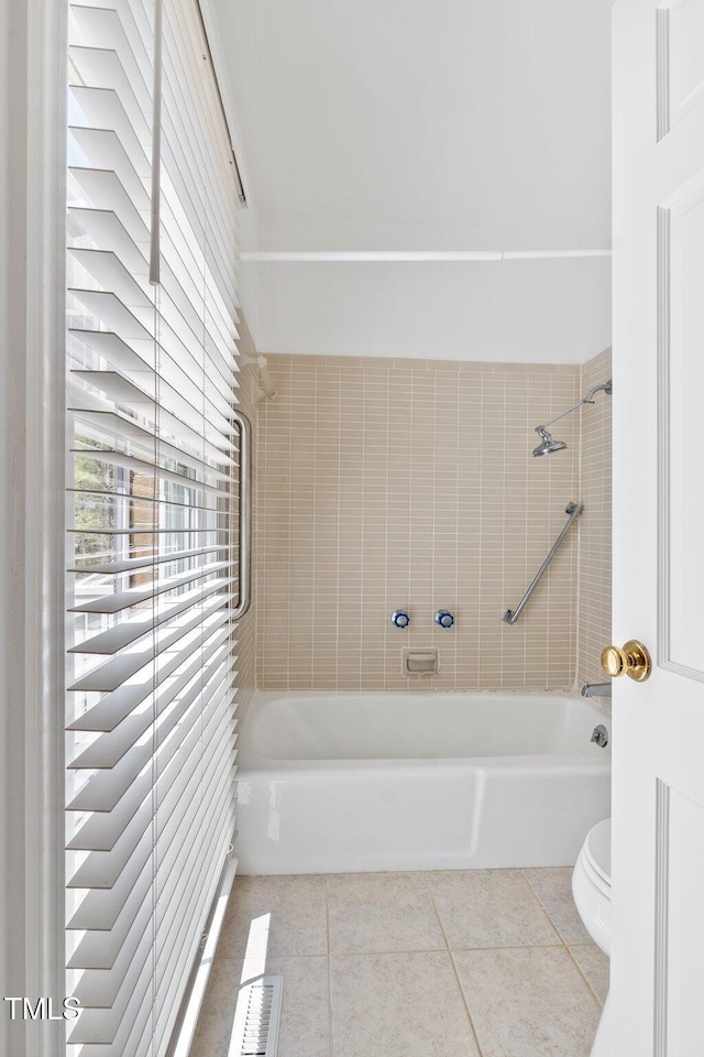 1302 Hermitage Rd, Sanford, NC 27330 - bathroom with toilet, tile patterned floors, and tub / shower combination