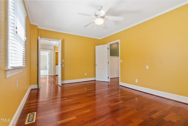 1302 Hermitage Rd, Sanford, NC 27330 - spare room with baseboards, wood finished floors, visible vents, and ornamental molding