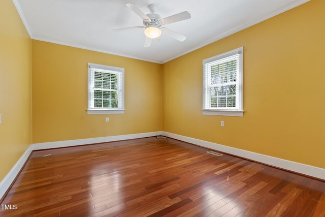 1302 Hermitage Rd, Sanford, NC 27330 - empty room featuring wood-type flooring, ornamental molding, and a wealth of natural light