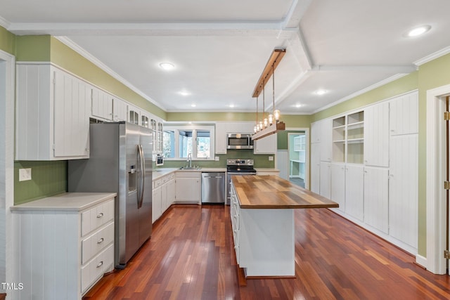 1302 Hermitage Rd, Sanford, NC 27330 - kitchen featuring stainless steel appliances, wood counters, dark wood-style flooring, and white cabinetry