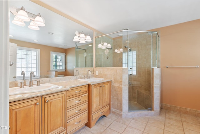 1302 Hermitage Rd, Sanford, NC 27330 - full bath featuring double vanity, a shower stall, and a sink