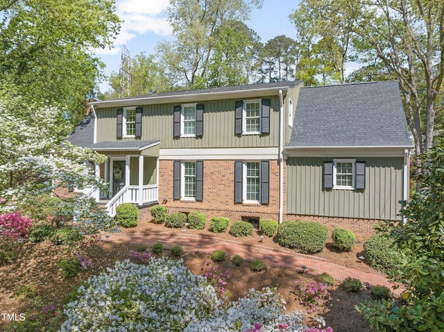 1302 Hermitage Rd, Sanford, NC 27330 - traditional-style home with brick siding, roof with shingles, and board and batten siding