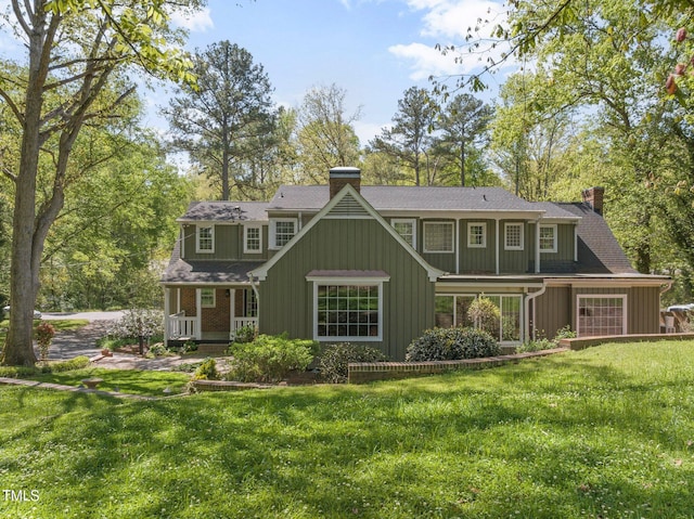 1302 Hermitage Rd, Sanford, NC 27330 - back of house with a chimney, a porch, a shingled roof, and a lawn