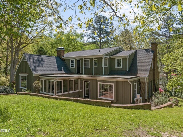 1302 Hermitage Rd, Sanford, NC 27330 - rear view of property with a chimney, a yard, and a shingled roof