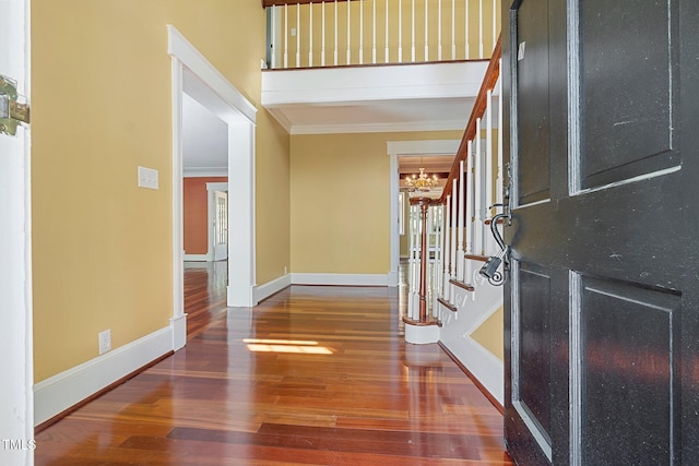 1302 Hermitage Rd, Sanford, NC 27330 - entryway with stairs, ornamental molding, a chandelier, and wood finished floors