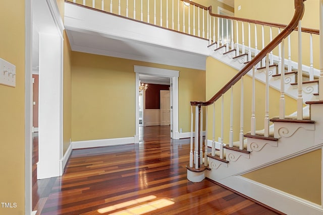 1302 Hermitage Rd, Sanford, NC 27330 - staircase featuring wood finished floors, crown molding, and baseboards