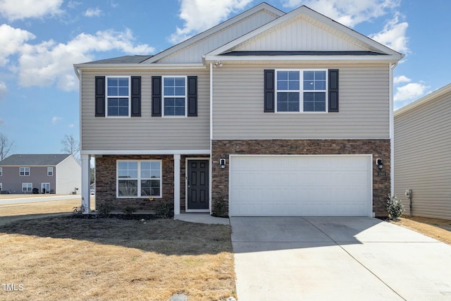 view of front of home with stone siding, a garage, a front yard, board and batten siding, and driveway