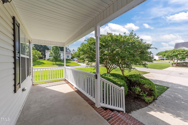 view of patio with a residential view and covered porch