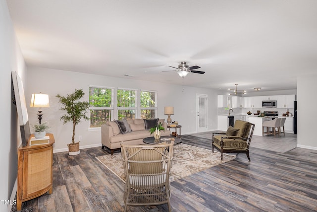 709 Conifer Ct, Creedmoor, NC 27522 - living area with dark wood-style flooring, baseboards, and a ceiling fan