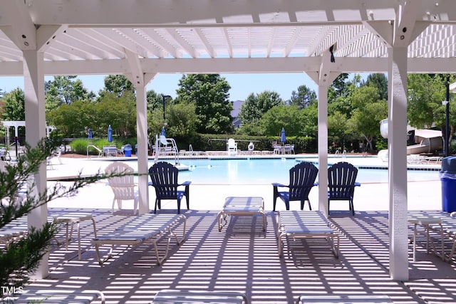 view of patio / terrace with a pergola and a community pool
