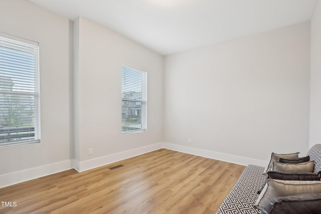 5616 Horsewalk Cir, Raleigh, NC 27606 - unfurnished room featuring light wood-style flooring, visible vents, and baseboards