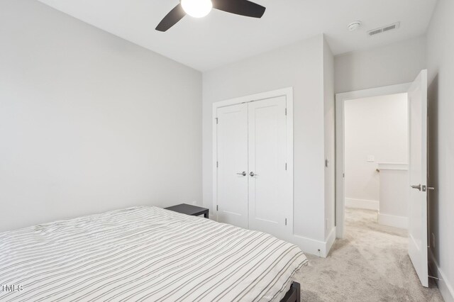 5616 Horsewalk Cir, Raleigh, NC 27606 - bedroom featuring visible vents, baseboards, a closet, ceiling fan, and light colored carpet