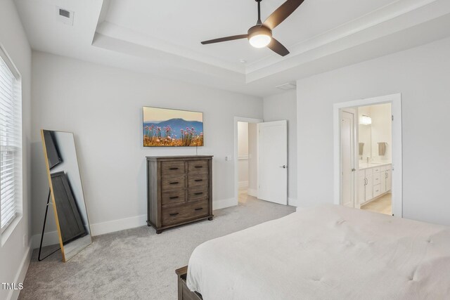 5616 Horsewalk Cir, Raleigh, NC 27606 - bedroom featuring a raised ceiling, light carpet, multiple windows, and visible vents