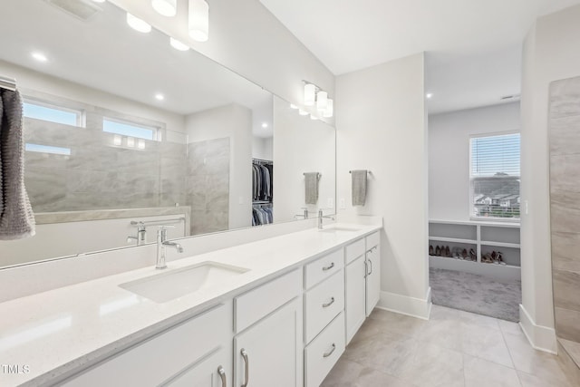 5616 Horsewalk Cir, Raleigh, NC 27606 - full bath with a sink, visible vents, and a wealth of natural light