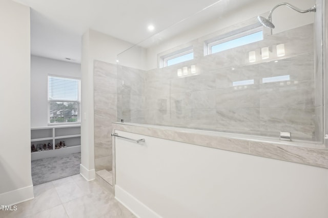 5616 Horsewalk Cir, Raleigh, NC 27606 - bathroom featuring a walk in shower, baseboards, and a healthy amount of sunlight