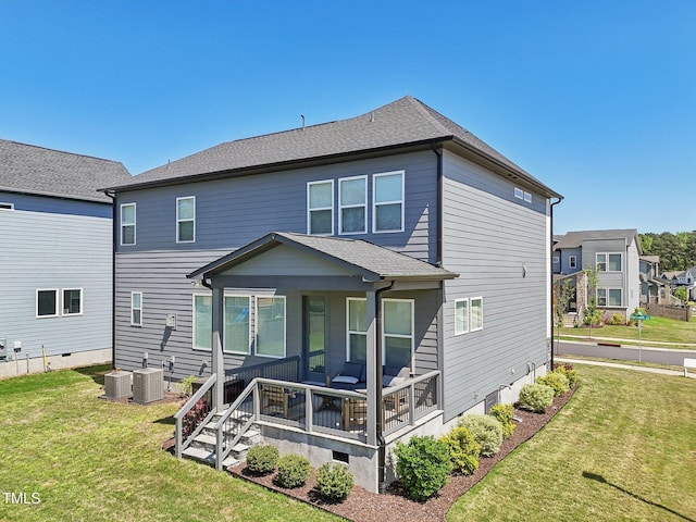 5616 Horsewalk Cir, Raleigh, NC 27606 - rear view of house with central AC, a lawn, and covered porch