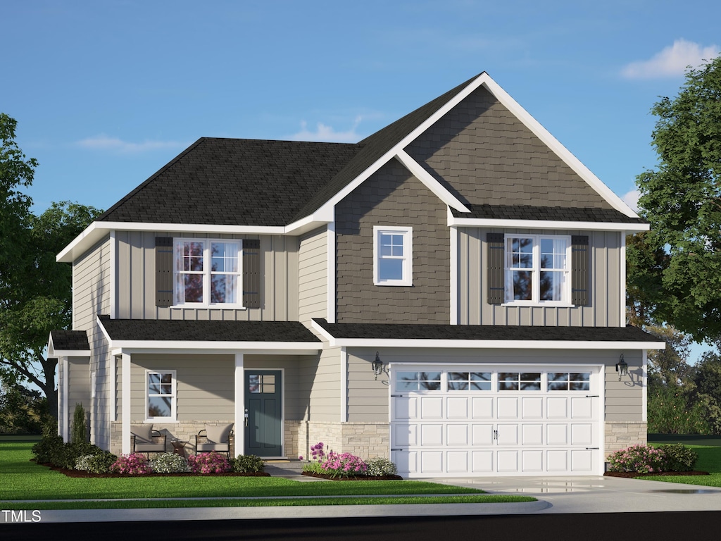 craftsman house with board and batten siding, covered porch, a garage, concrete driveway, and stone siding