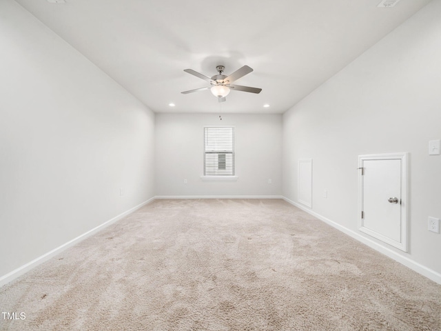 carpeted empty room featuring ceiling fan, baseboards, and recessed lighting
