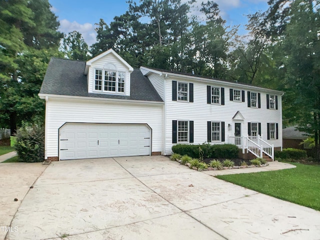 4601 Pemberton Dr, Raleigh, NC 27609 - colonial home featuring concrete driveway and a garage