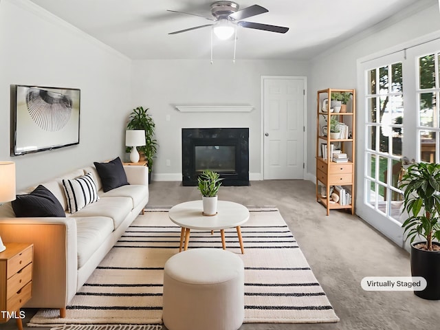4601 Pemberton Dr, Raleigh, NC 27609 - living area with a glass covered fireplace, ceiling fan, carpet, and crown molding