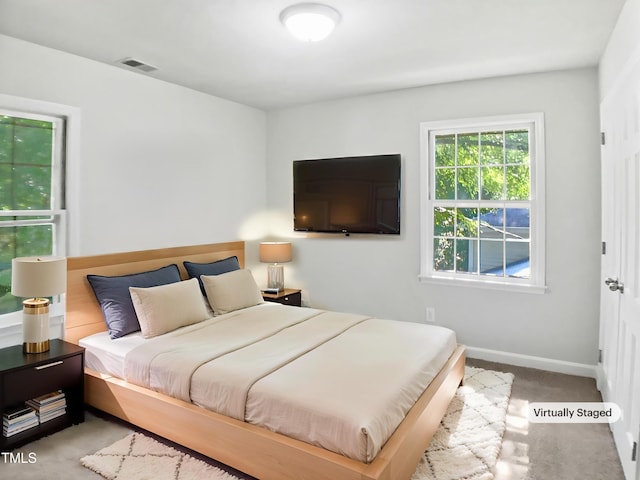 4601 Pemberton Dr, Raleigh, NC 27609 - carpeted bedroom with baseboards
