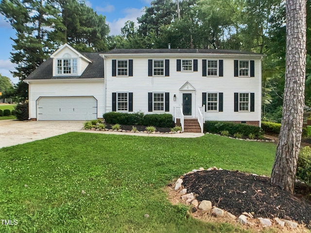 4601 Pemberton Dr, Raleigh, NC 27609 - colonial inspired home with driveway, an attached garage, and a front yard
