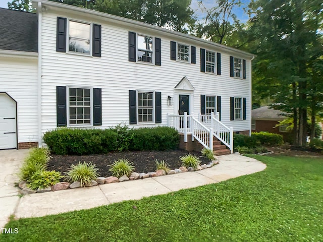 4601 Pemberton Dr, Raleigh, NC 27609 - colonial house featuring a front lawn