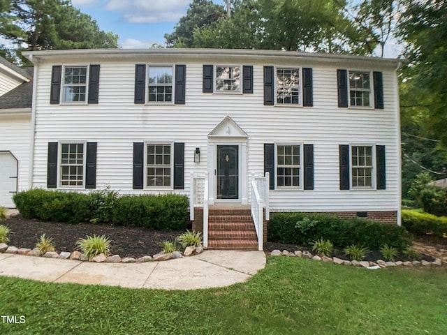 4601 Pemberton Dr, Raleigh, NC 27609 - colonial home featuring an attached garage and a front yard