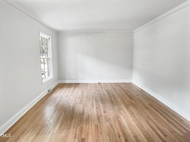 4601 Pemberton Dr, Raleigh, NC 27609 - spare room featuring ornamental molding and light wood-type flooring