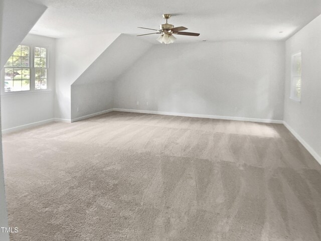 4601 Pemberton Dr, Raleigh, NC 27609 - additional living space with ceiling fan, carpet, and vaulted ceiling