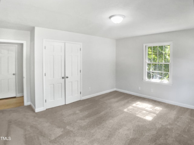 4601 Pemberton Dr, Raleigh, NC 27609 - unfurnished bedroom featuring carpet flooring and a closet