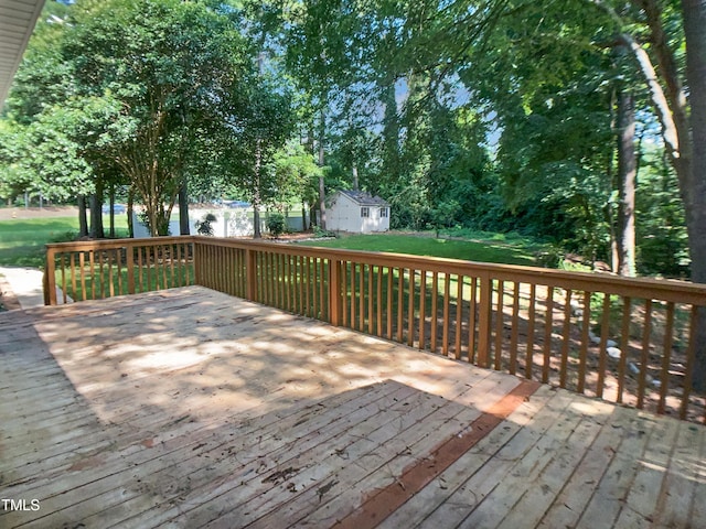 4601 Pemberton Dr, Raleigh, NC 27609 - wooden terrace featuring a yard and an outbuilding