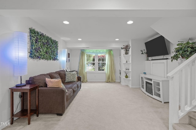 living room featuring light colored carpet, recessed lighting, and baseboards
