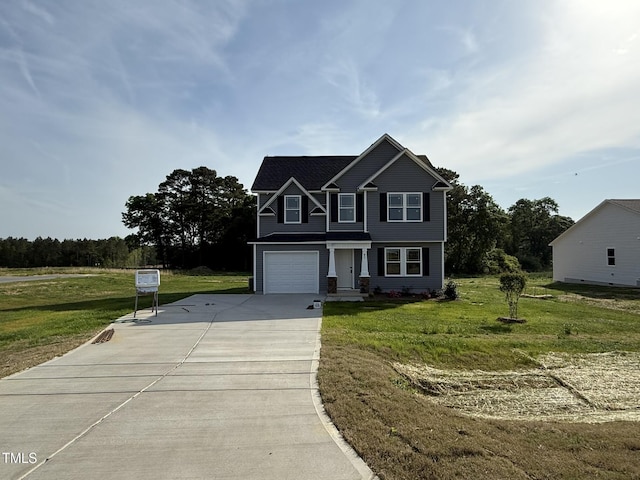 view of front of property with a garage, driveway, and a front yard