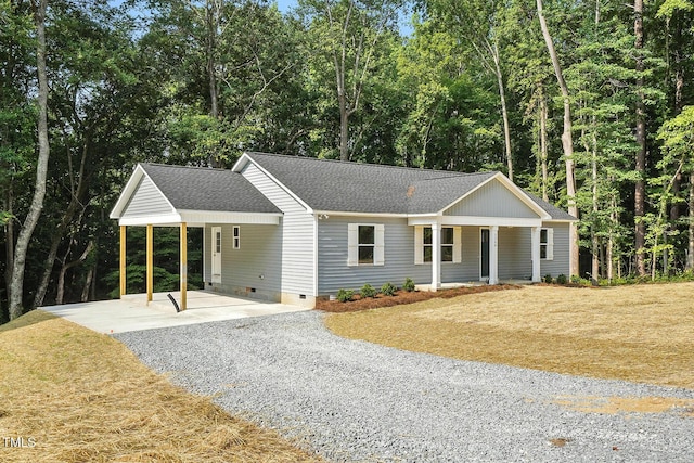 5500 Lake Wendell Rd, Zebulon, NC 27597 - ranch-style house featuring crawl space, roof with shingles, gravel driveway, an attached carport, and a front yard