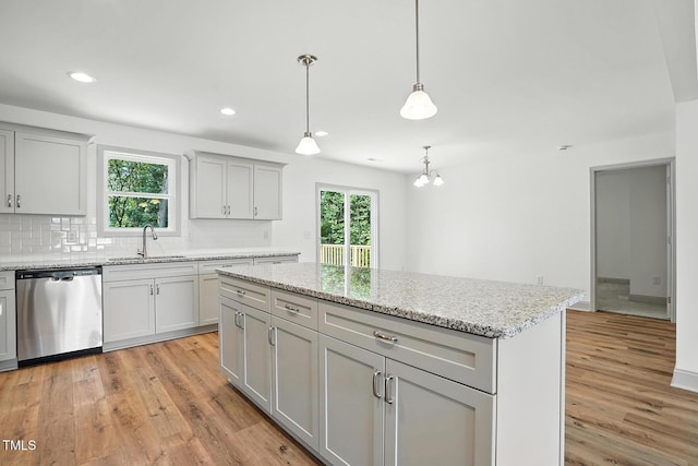 5500 Lake Wendell Rd, Zebulon, NC 27597 - kitchen with dishwasher, light wood finished floors, a center island, tasteful backsplash, and recessed lighting