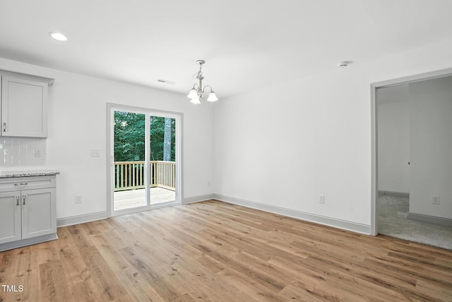 5500 Lake Wendell Rd, Zebulon, NC 27597 - unfurnished dining area featuring light wood-style floors, a chandelier, and recessed lighting