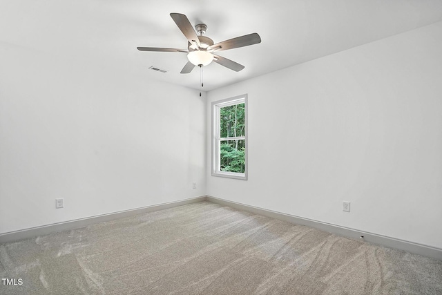 5500 Lake Wendell Rd, Zebulon, NC 27597 - spare room featuring carpet flooring and a ceiling fan