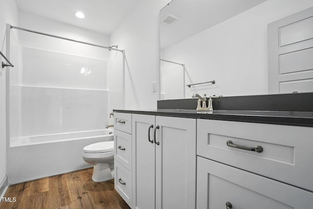 5500 Lake Wendell Rd, Zebulon, NC 27597 - full bathroom with  shower combination, vanity, wood finished floors, and recessed lighting