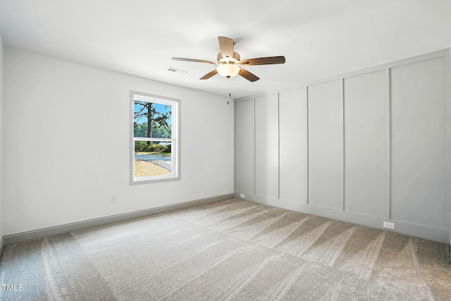 5500 Lake Wendell Rd, Zebulon, NC 27597 - carpeted empty room featuring a ceiling fan and a decorative wall