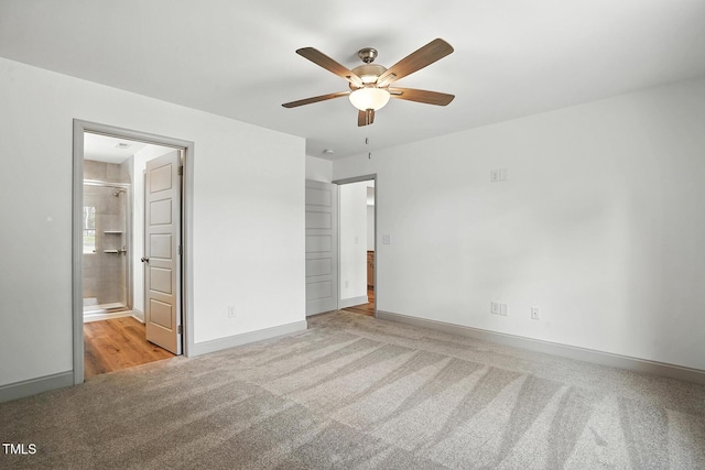 5500 Lake Wendell Rd, Zebulon, NC 27597 - unfurnished bedroom with carpet flooring, ensuite bathroom, and a ceiling fan