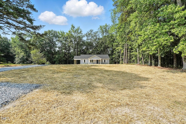 5500 Lake Wendell Rd, Zebulon, NC 27597 - view of green lawn featuring a forest view